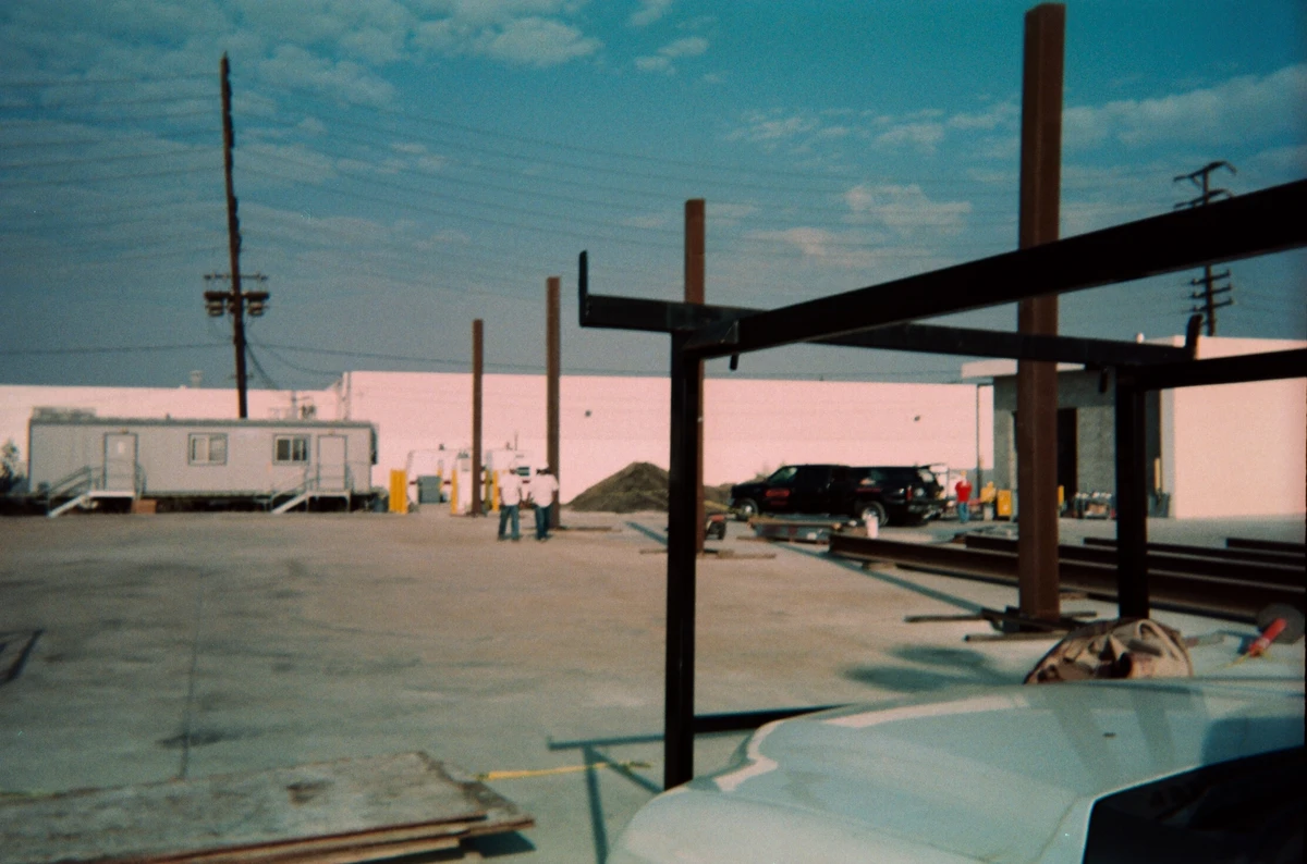 Archival construction photograph showing steel beams and columns being assembled