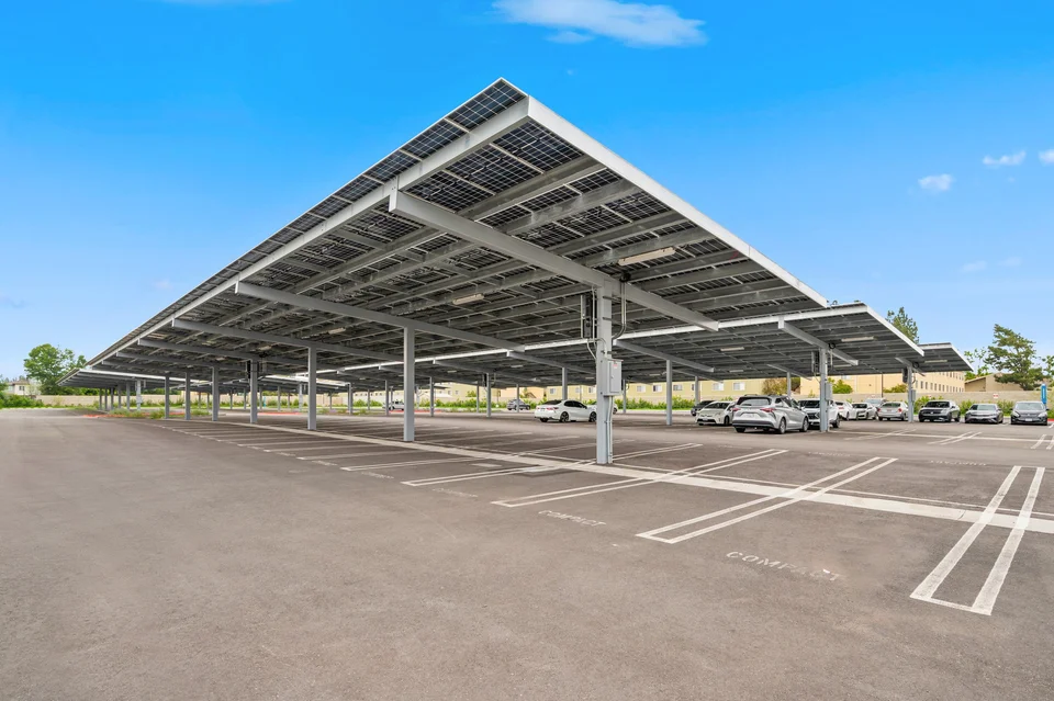 Solar carport rows with clear views of the steel framing and parking bays