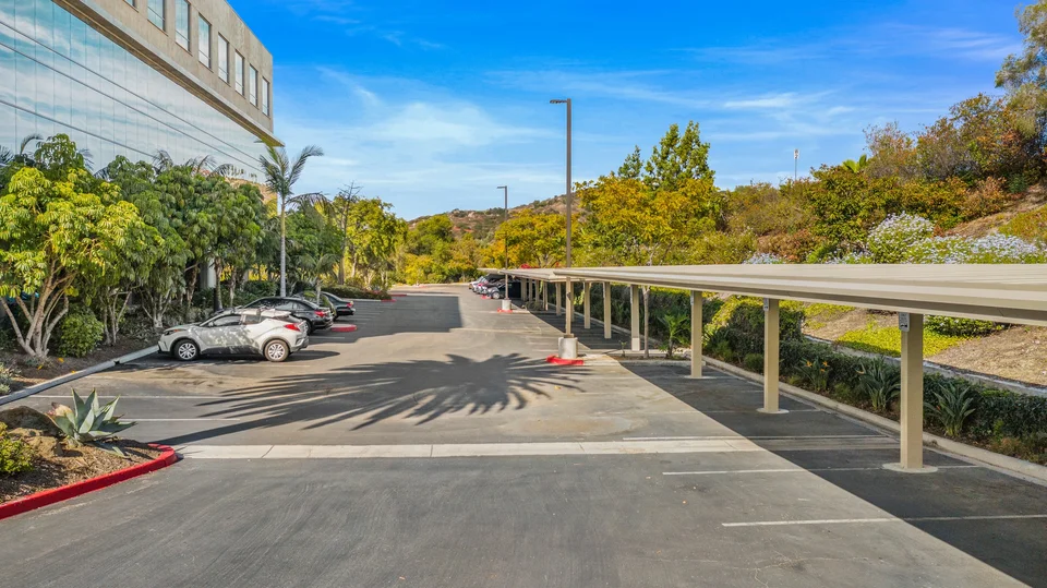 Non-solar metal roofs over landscaped commercial parking