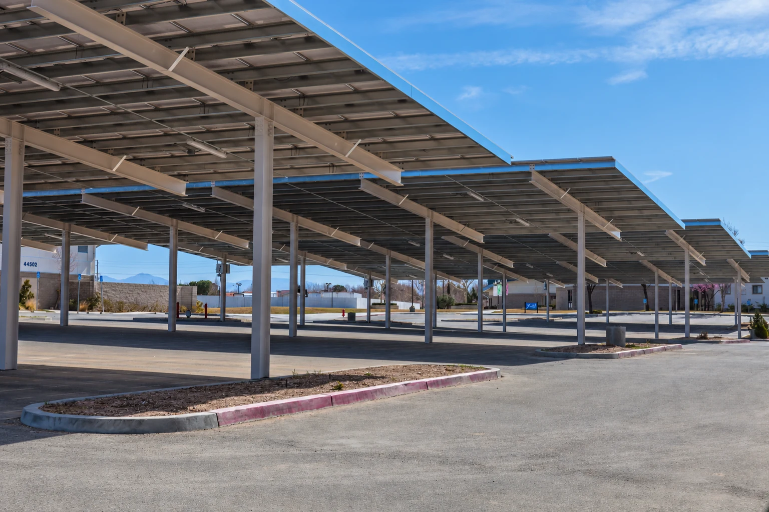 Steel solar carports covering the parking area at Central Christian Church
