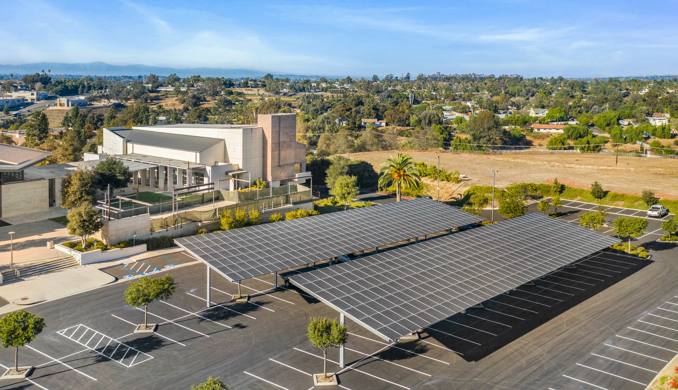 Aerial view of solar carports beside the St. Thomas church campus