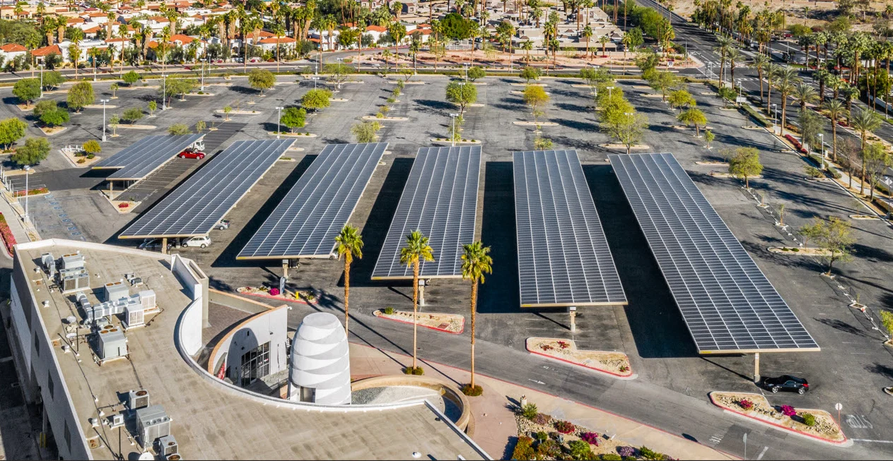 Completed solar carports photographed above a parking lot