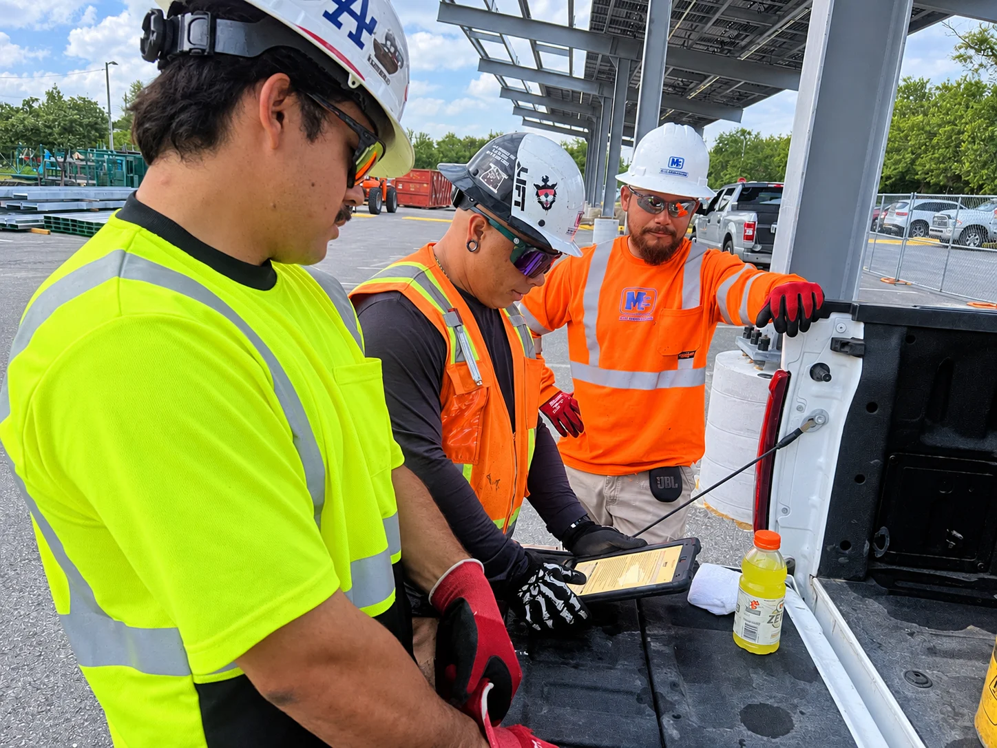 M Bar C crew reviewing information together at a jobsite